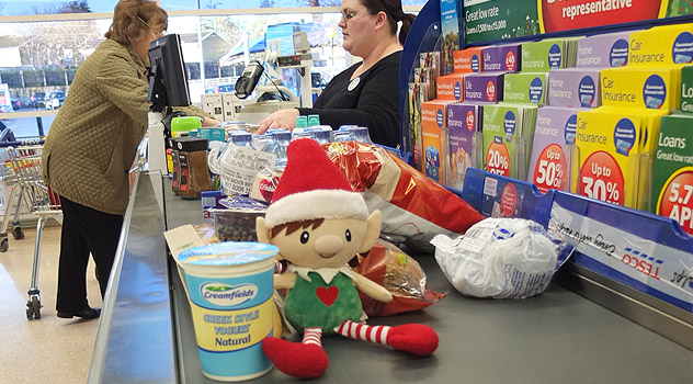 Christmas Elf in Supermarket at Checkouts